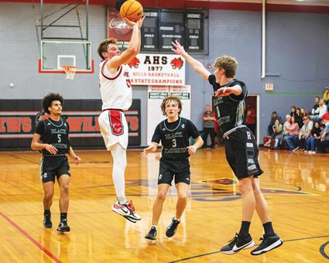 Cannon Crompton/sports@cherokeescout.com Ty Clark of Andrews puts up a 3-pointer in their game against Robbinsville on Dec. 17.