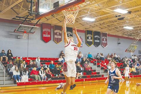 Cannon Crompton/sports@cherokeescout.com Ty Clark of Andrews goes up to drain a shot against Summit Charter on Dec. 4.