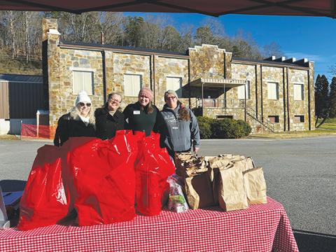 Holiday eating: Volunteers helped make it possible to provide a Christmas meal for more than 300 local residents on Dec. 25.