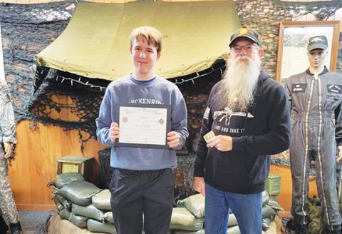 Nicole Wright/Staff Correspondent Scott Ramler, commander of Andrews Veterans of Foreign Wars Post 7620, presents the annual Voice of Democracy essay award to contest winner John Durham (left), a junior at Murphy High School.  