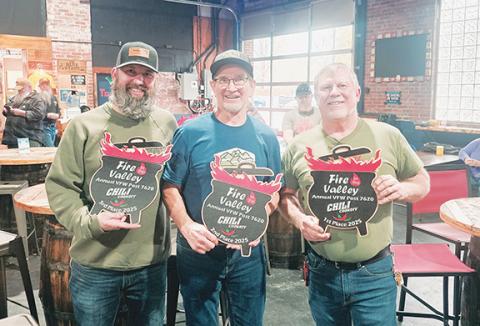Photos by Nicole Wright/Staff Correspondent The winners of the seventh annual Andrews Veterans of Foreign Wars Post 7620 Fire in the Valley chili cook-off are (from left): third place, Corey Thompson of Hoppy Trout Brewing Co.; second place, Curt Steinlage of Morning Fog Coffee & Eats; and in first place was Duron Smith of Cups & Cones. 