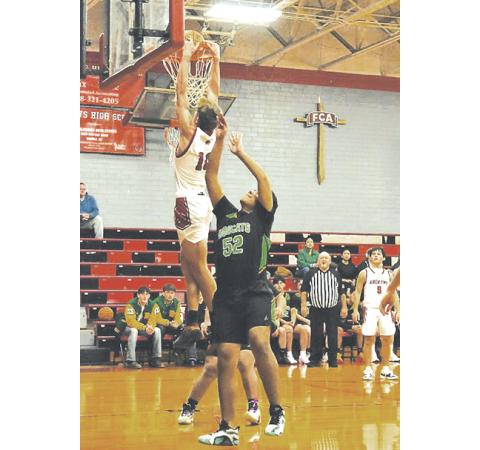 Bre Woodard/Staff Correspondent Myca Mustin of Andrews drives it home with a dunk against Blue Ridge Early College on Jan. 7.