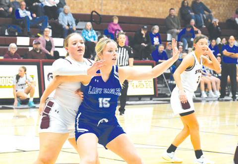 April McNabb/Contributing Photographer Olivia McNabb of Hiwassee Dam calls for the ball while holding off a Swain County defender in their game Friday.