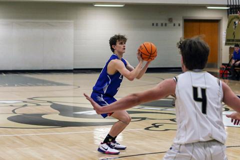 Cannon Crompton/sports@cherokeescout.com Hiwassee Dam freshman Jonah Dockery shoots a 3-pointer against Hayesville in their game on Jan. 7.