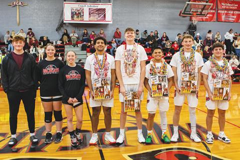 Cannon Crompton/sports@cherokeescout.com The Class of 2025 winter athletes were honored before the basketball game on Feb. 11. From left are William Wood, Demi Davis, Kylie Donaldson, Landon Greene, Braxton Rickett, Kegan Ellis, Ty Clark and Eli Aguilar. 
