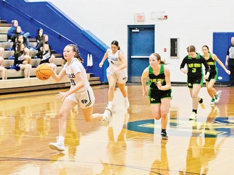 Cannon Crompton/sports@cherokeescout.com Abby Harris of Hiwassee Dam dribbles down the court on a fast break following a steal against Blue Ridge Early College on Friday night.