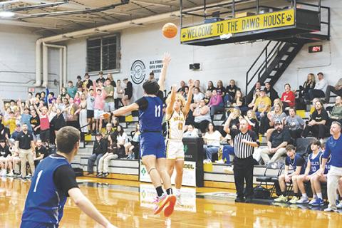 Cannon Crompton/sports@cherokeescout.com Ryan Payne of Murphy shoots a 3-pointer as Aidan Bennett of Hiwassee Dam attempt to block the shot Thursday. 