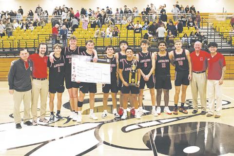 Cannon Crompton/sports@cherokeescout.com The 2024-25 Smoky Mountain Conference champions are the Andrews Wildcats. From left are assistant coach Eric Duong, head coach Matt Maennle, Gabe Clark, Braxton Rickett, Ty Clark, Eli Aguilar, LaDannien Rattler, Kegan Ellis, Logan Shuler, Landon Greene, Myca Mustin, assistant coach Frank Maennle and assistant coach Kabe Ellis.