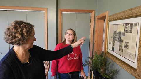 Nicole Wright/Staff Correspondent  Caroline Swan (right) discusses various memories while touring the historic Walker Inn with owner Jessica Rickett during the a Christmas tour in Andrews on Nov. 23. Rickett, along with husband Phillip, are looking forward to re-opening the inn for guests and already have one on-site cabin available for rentals. The tour offered the community an opportunity to revisit one of the town’s most popular attractions. The Ricketts recently purchased the inn and are readying for va
