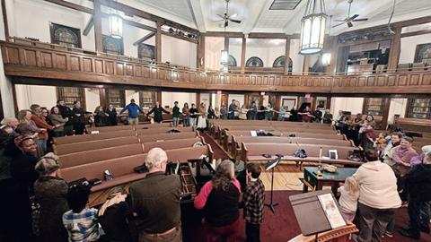 Photos by Nicole Wright/Staff Correspondent Attendees of all ages enjoy the sing-a-long to “We Shall Overcome” to culminate the Community Sing to Celebrate Black History Month and Songs of the Civil Rights Movement on Feb. 18 at Murphy First United Methodist Church. The singing was facilitated by featured performer Kristen George for One Dozen Who Care and grassroots organization Common Ground.