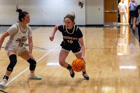 Cannon Crompton/sports@cherokeescout.com Kylie Donaldson (right) of Andrews drives past a Hayesville defender in their first matchup on Jan. 21.
