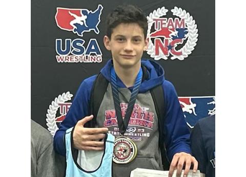 Janelle Lucksavage/Contributing Photographer Zander Lucksavage, an eighth-grader at Murphy Middle School, is shown after winning a state wrestling championship Saturday in the 126-pound weight class.