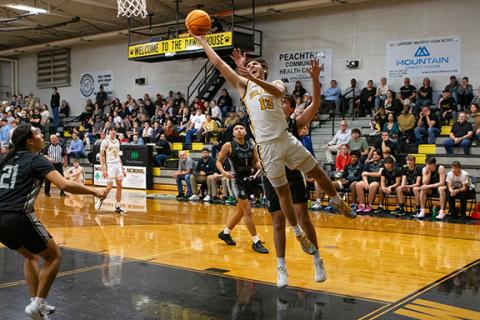 Cannon Crompton/sports@cherokeescout.com Cale Harger fights his way to the hoop to make a layup against Robbinsville on Jan. 28.