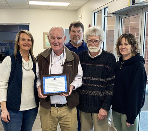 A plaque was given to Noland Smith honoring his service to the Murphy Pool & Fitness Center by members of the Hiwassee Valley Recreation Foundation. From left are Carmen Smith, Noland Smith, Gary “Hippy” Westmoreland, Dr. Brian Mitchell and Dana Swenson, facility director. Not shown are members Paige Brinke and Bill Vespasian.