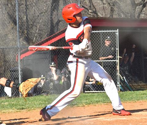 Andrews’ Kegan Ellis swings at an incoming pitch during the Wildcats’ game against Hayesville on March 14. Bre Woodard/Staff Correspondent 