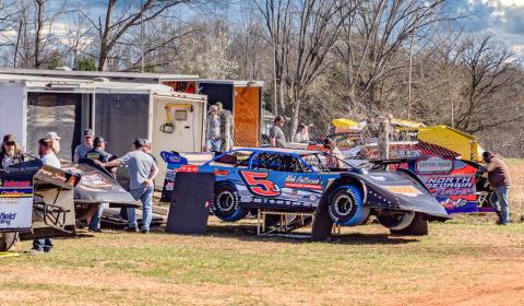 Crews work on their cars ahead of the first race back at Tri-County Racetrack in Brasstown on Saturday. Sam Jokich/Staff Correspondent  
