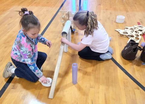 Reese Woods (left) and Paislee Ellison (right) create a network of highways at the Ramps and Pathways station at Andrews Elementary School’s Full STEAM Ahead event on March 18. The night was put on by the Creative Discovery Museum of Chattanooga, Tenn., as a night for students to explore fun in learning about Science, Technology, Engineering, Art & Math. Photos by Nicole Wright/Staff Correspondent 