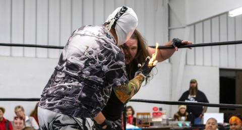 Ghost gets Billy Havoc in the corner before he hits him with the flaming hand in their match on Jan. 4. Cannon Crompton/sports@cherokeescout.com 