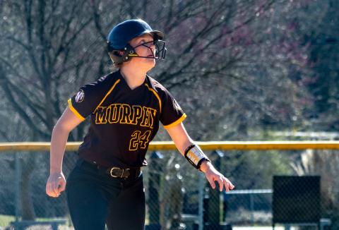 Emma Laney of Murphy eyes a pop fly before running safely to third base on March 19. Cannon Crompton/ sports@cherokeescout.com