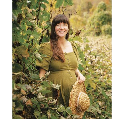 Courtesy of GunandGarden.com In the spotlight: Delia Fian wanders through a kudzu patch near Murphy.