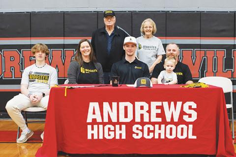 Cannon Crompton/ sports@cherokeescout.com Andrews High School senior Everett Tatham signed a letter of commitment to play football at the College of Wooster in Ohio on Friday. Everett was joined by (front row, seated from left) his brother Wade Tatham, mother Sarah Tatham, nephew Lucas Tatham and father Jeff Tatham, as well as (back row, standing from left) his grandfather Jerry Tatham and grandmother Shirley Tatham. While playing football, Everett plans on majoring in political science and minoring in psyc