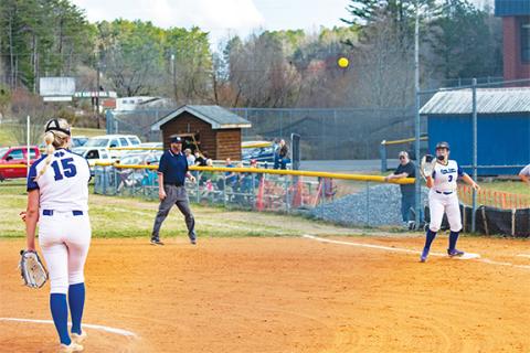 Cannon Crompton/sports@cherokeescout.com Hiwassee Dam’s Olivia McNabb (left) throws to first baseman Avery McNabb to get the out against Swain County on Friday. 