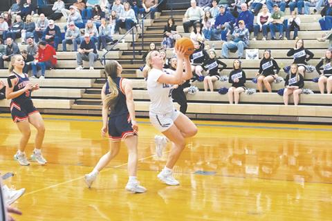 Cannon Crompton/sports@cherokeescout.com Hiwassee Dam senior Olivia McNabb drives past a defender to make a layup against Starmount on Feb. 25