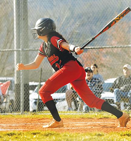 Bre Woodard/Staff Correspondent  Lady Wildcat Chanteah Rattler makes contact with the ball against Hayesville on Friday.