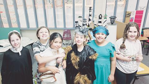 Photos by Nicole Wright/Staff Correspondent From left, fifth-graders Sofia Gallagher as Mary Lyon, AJ Jones as Emma Willard, Sofia Morales as Emma Willard, Zydisiah Allen as Mary Cassatt, Krislynn White as Phyllis Wheatley and Aimee Day as Rosa Parks during Andrews Elementary School’s “Living History Museum” on Feb. 18. Students dressed up as “American Heroes” and gave interactive demonstrations about the people they portrayed to engage with U.S. history beyond the printed page.