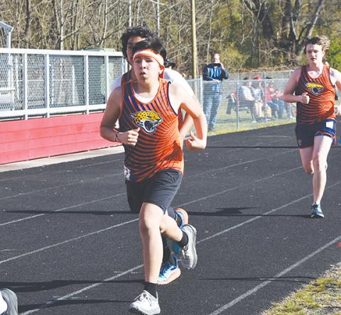 Bre Woodard/Staff Correspondent Elias Diaz-Menchu runs in an event at Andrews High School on March 19.
