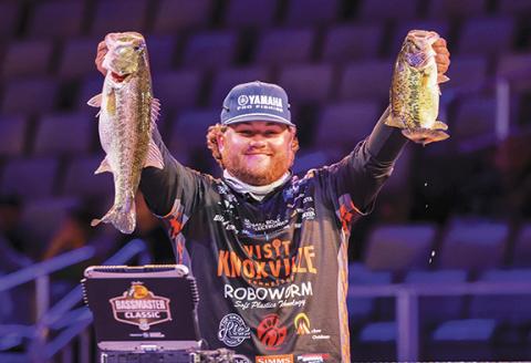 Professional angler Robert Gee weighs in following the first day of the Bassmaster Classic on March 21. 