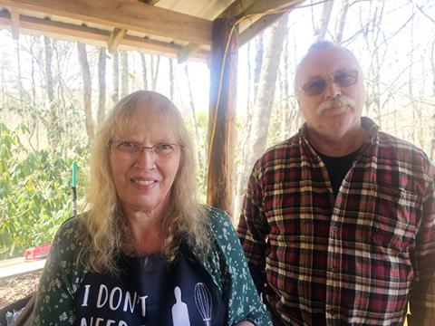 Nicole Wright/Staff Correspondent Patty Ann Waters (left) leads the volunteer efforts along with pastor Robin Stiles (right) for the monthly Manna Food Market’s offerings at Aquone Baptist Church in Topton. The market is held on the first Tuesday of every month at the church.