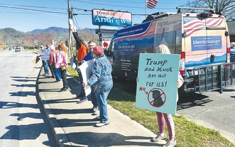 Photos by Randy Foster/ editor@cherokeescout.com More than a dozen protesters surrounded the Carolina Cruiser of U.S. Rep. Chuck Edwards (R-N.C.) outside Andrews Town Hall on March 26. Protesters have been following town halls and public events by mainly Republican congressional members in protest of moves made by President Donald Trump’s administration. They expressed concern about issues such as veterans benefits, education and national parks. Edwards was not at the Andrews event, but was represented by t