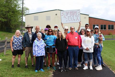 Cannon Crompton/sports@cherokeescout.com A group of athletes gather before starting the fun walk at the 2024 Senior Games opening day on April 20, 2024. 