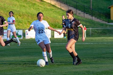 Cannon Crompton/sports@cherokeescout.com Murphy’s Ella Ledford (right) takes the ball down the field as Iris Diaz-Menchu of Tri-County Early College defends in their match on April 16.