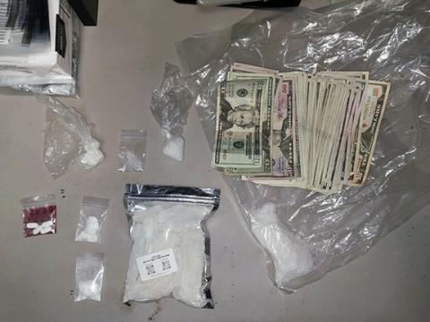 A display shows items seized during the March 25 drug raid that resulted in the arrest of Elizabeth N. Pulaski