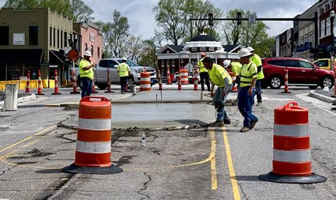 Randy Foster/editor@cherokeescout.com Workers hired by the N.C. Department of Transportation install a concrete island on Hiwassee Street at the new roundabout being built in downtown Murphy on Monday morning. On Tuesday, Valley River Avenue at the roundabout was closed, and traffic detoured, while work was in progress. Stay alert for other potential changes.