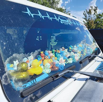 Photos by Anngee Quinones-Belian/Staff Correspondent  Admired vehicles are hard to miss when brightly colored toys sit atop the dashboard.