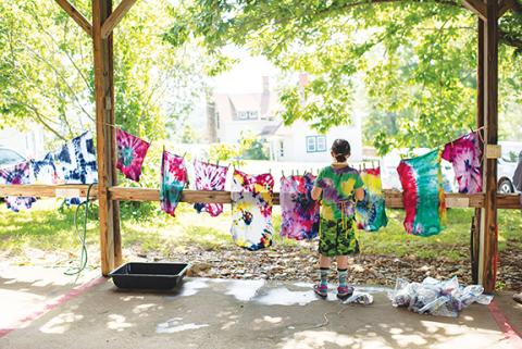 Courtesy of John C. Campbell Folk School A clothesline of many colors: A Little Middle Folk School student analyzes tie-dye projects on a clothesline during a previous event.
