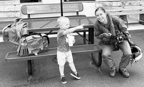 Gary James/Contributing Photographer U.S. Marine Corps 1st Lt. Shea Auge of Los Lunas, N.M., greets 3-year-old Zechariah Abernathy of Andrews outside the terminal at Western Carolina Regional Airport on May 8. Auge’s unit, Marine Heavy Helicopter Training Squadron 302 based at New River Marine Air Station in Onslow County, has been training in Cherokee County for the past few weeks. The squadron, known as the “Phoenix,” trains newly designated naval aviators, conversion pilots, refresher pilots and enlisted