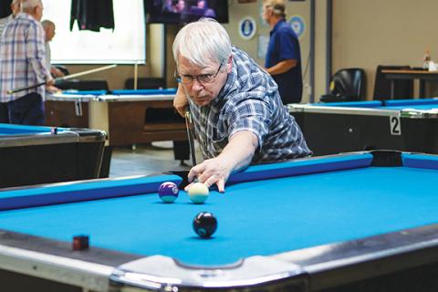 Cannon Crompton/sports@cherokeescout.com Brian Kearney lines up his shot looking to pocket the 8 ball to win the game at the 2025 Cherokee/Clay Senior Games billiards competition on May 14 at Rack ‘Em Billiards in Murphy.