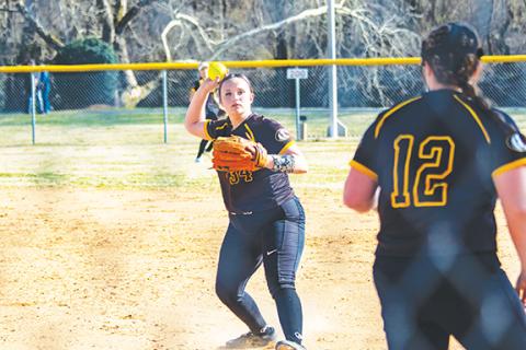 Cannon Crompton/sports@cherokeescout.com Piper Dalton (left) throws the ball to Gracie Thrasher to record an out against Tellico Plains, Tenn., on March 11.