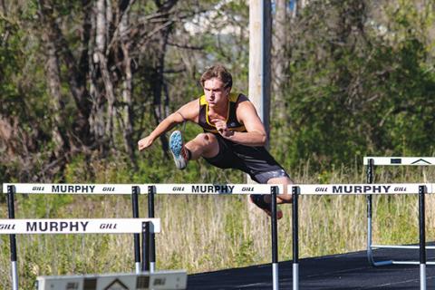 Cannon Crompton/sports@cherokeescout.com Camden Breazeale of Murphy competes in the hurdle events during the Dogs’ April 16 meet at Murphy High School.