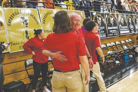 Cannon Crompton/sports@cherokeescout.com Matt (left) and Frank Maennle hug after winning the 2024-25 basketball Smoky Mountain Conference championship on Feb. 22.