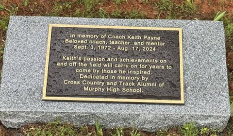 This stone placed at the Murphy High School track Saturday honors late track and field coach Keith Payne.