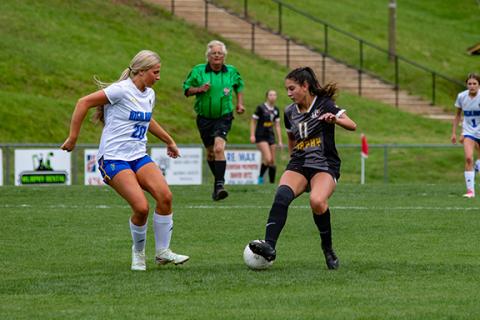 Cannon Crompton/sports@cherokeescout.com Brooklyn Johnson of Murphy cuts back past a Highlands defender in their match on May 5.