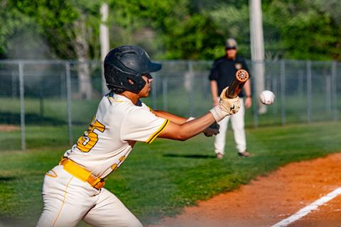 Photos by Cannon Crompton/sports@cherokeescout.com Alex Roldan of Murphy makes contact on a bunt looking to advance runners against Hiwassee Dam on Monday. 
