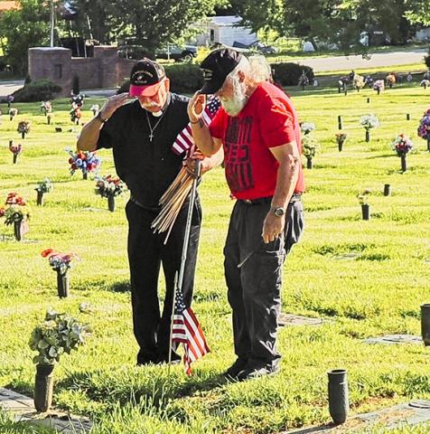 Sam Jokich/ Correspondent U.S. flags  were placed on veterans’ graves Friday at Greenlawn Cemetery in Peachtree, continuing a long local tradition.