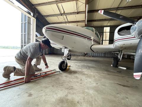 Randy Foster/editor@cherokeescout.com Airport Manager Chris Williams attaches a tow line to an airplane at Western Carolina Regional Airport in Andrews in this 2023 photo taken shortly after Williams was hired.