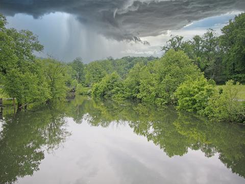 Sam Jokich/Contributing Photographer The Valley River was swollen around the playground at Konehete Veterans Park in Murphy after hard rains fell last week.